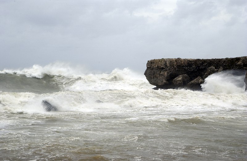 Waves, Due to Stormy Winds and Weather Caused by Hurricane Dennis, at Cable Beach, Naval Station Guantanamo Bay, July 8, 2005, Guantanamo Bay, Republica de Cuba - Republic of Cuba. Photo Credit: Photographer's Mate 1st Class Terry Matlock, Navy NewsStand - Eye on the Fleet Photo Gallery (http://www.news.navy.mil/view_photos.asp, 050708-N-2903M-002), United States Navy (USN, http://www.navy.mil), United States Department of Defense (DoD, http://www.DefenseLink.mil or http://www.dod.gov), Government of the United States of America (USA).