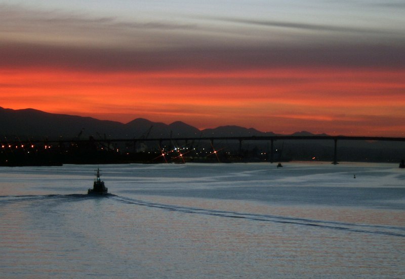 19. Sunrise at the Harbor, January 26, 2006, San Diego, State of California, USA. Photo Credit: DM1 Carmen O. Hubbs, United States Navy (USN, http://www.navy.mil); Defense Visual Information Center (DVIC, http://www.DoDMedia.osd.mil, DNSD0701645 and 060126N3314H010) and United States Air Force (USAF, http://www.af.mil), United States Department of Defense (DoD, http://www.DefenseLink.mil or http://www.dod.gov), Government of the United States of America (USA).