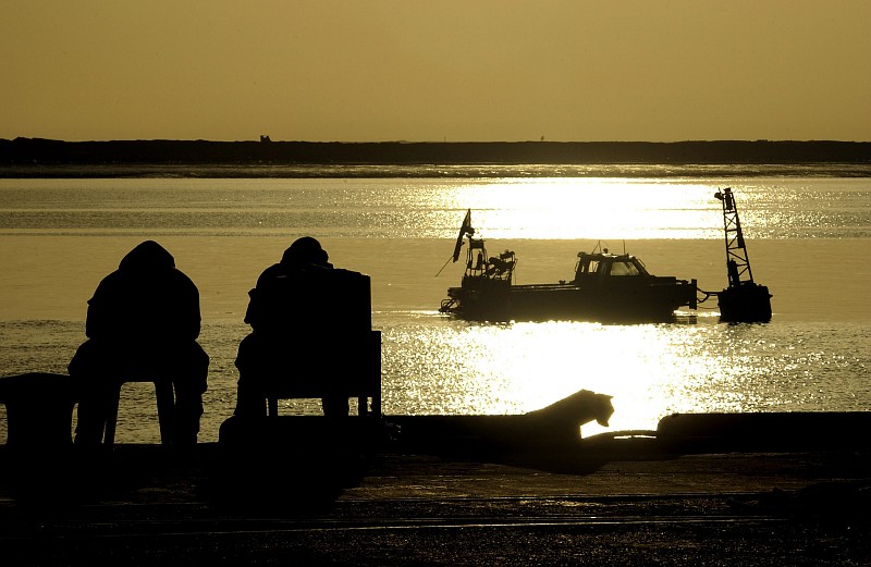 64. They Watch the Sun Rise Over the Port of Umm Qasr on March 28, 2003, Umm Qasr, Al Jumhuriyah al Iraqiyah - Republic of Iraq. Photo Credit: Photographer's Mate 2nd Class Bob Houlihan, Navy NewsStand - Eye on the Fleet Photo Gallery (http://www.news.navy.mil/view_photos.asp, 030328-N-3783H-152), United States Navy (USN, http://www.navy.mil), United States Department of Defense (DoD, http://www.DefenseLink.mil or http://www.dod.gov), Government of the United States of America (USA).