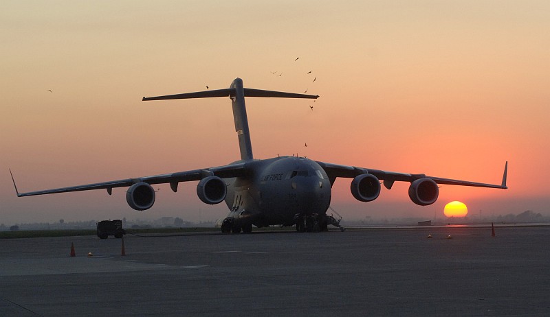 68. Birds Soar Above a USAF C-17 Globemaster III During the Rising or Setting of the Sun, November 16, 2006, Incirlik Air Base, Turkiye Cumhuriyeti - Republic of Turkey. Photo Credit: Tech. Sgt. (TSGT) Larry A. Simmons, Air Force Link - Photos (http://www.af.mil/photos, 061116-F-4692S-003, 'Active flightline'), United States Air Force (USAF, http://www.af.mil), United States Department of Defense (DoD, http://www.DefenseLink.mil or http://www.dod.gov), Government of the United States of America (USA).