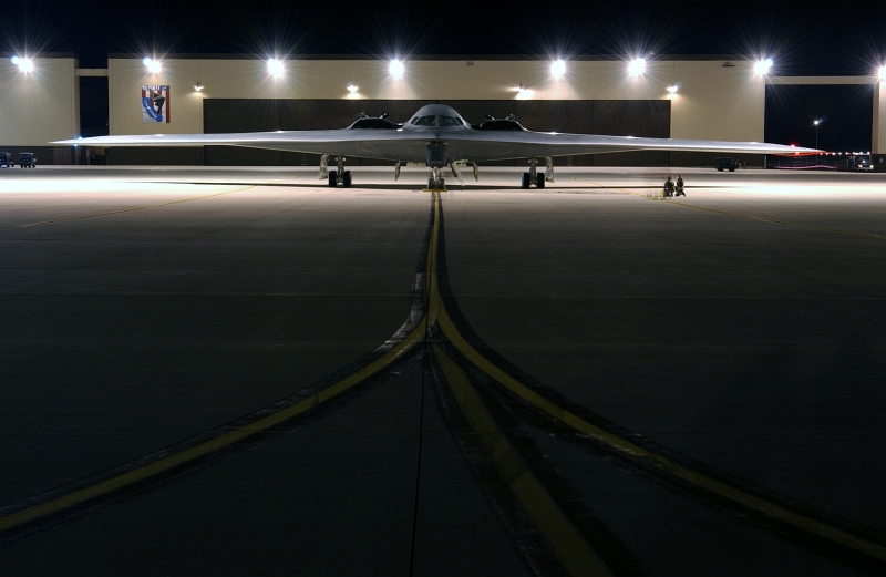 46. Engines Running, A U.S. Air Force B-2 Spirit Stealth Bomber Sits On the Ramp Before Going On A Combat Mission During Operation Iraqi Freedom, March 21, 2003, Whiteman Air Force Base, State of Missouri, USA. Photo Credit: Tech. Sgt. Michael R. Nixon, United States Air Force; Defense Visual Information (DVI, http://www.DefenseImagery.mil, 030321-F-WM157-009, DFSD0501354, and DF-SD-05-01354) and United States Air Force (USAF, http://www.af.mil), United States Department of Defense (DoD, http://www.DefenseLink.mil or http://www.dod.gov), Government of the United States of America (USA).