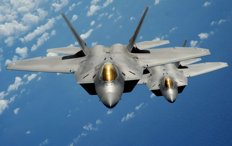 23. Two U.S. Air Force F-22A Raptor Stealth Fighter Jets Fly Together Over the Pacific Ocean, March 9, 2009. Photo Credit: Master Sgt. Kevin J. Gruenwald, United States Air Force; Defense Visual Information (DVI, http://www.DefenseImagery.mil, 090309-F-6911G-207) and United States Air Force (USAF, http://www.af.mil), United States Department of Defense (DoD, http://www.DefenseLink.mil or http://www.dod.gov), Government of the United States of America (USA).