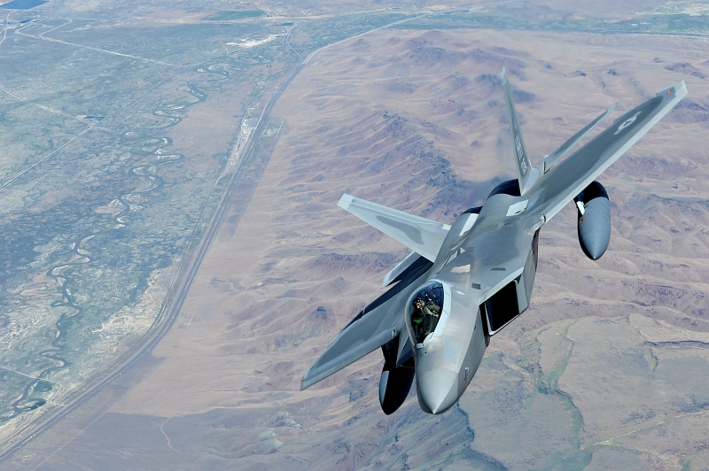 21. U.S Air Force F-22A Raptor Stealth Fighter Jet Flies Over Colorful Terrain While Traveling From Hill Air Force Base, Utah, to Joint Base Pearl Harbor-Hickam, Hawaii, USA, July 2, 2010. Photo Cedit: Senior Airman Gustavo Gonzalez, United States Air Force; Air Force Link - Photos (http://www.af.mil/photos, 100702-F-4815G-105), United States Air Force (USAF, http://www.af.mil), United States Department of Defense (DoD, http://www.DefenseLink.mil or http://www.dod.gov), Government of the United States of America (USA).