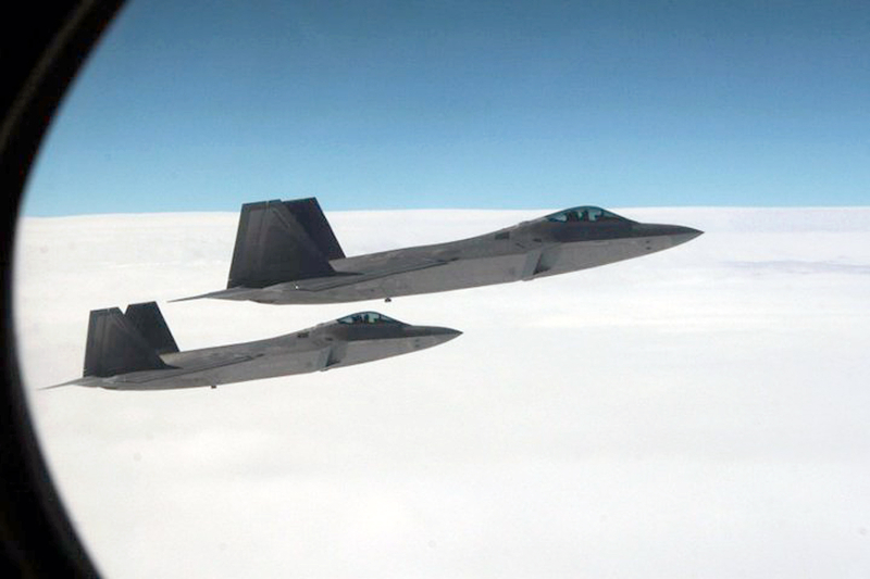 26. Joint NORAD-Russian Federation Exercise VIGILANT EAGLE: High Above Alaska, Two U.S. Air Force F-22A Raptor Stealth Fighter Jets Intercept and Escort a Gulfstream IV (Gulfstream 4) Jet (Code-named "Fencing 1220") During the International Hijacking Scenario, August 2010, State of Alaska, USA. Photo Credit: Major Michael S. Humphreys, United States Army; Defense Visual Information (DVI, http://www.DefenseImagery.mil) and North American Aerospace Defense Command (NORAD, http://www.norad.mil, 100808-A-0000H-007), United States Department of Defense (DoD, http://www.DefenseLink.mil or http://www.dod.gov), Government of the United States of America (USA).