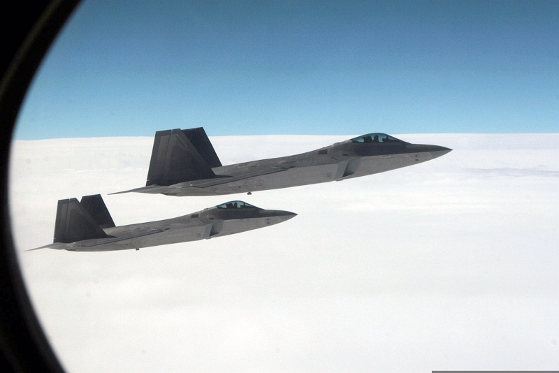 26. Joint NORAD-Russian Federation Exercise VIGILANT EAGLE: High Above Alaska, Two U.S. Air Force F-22A Raptor Stealth Fighter Jets Intercept and Escort a Gulfstream IV (Gulfstream 4) Jet (Code-named "Fencing 1220") During the International Hijacking Senario, August 2010, State of Alaska, USA. Photo Credit: Major Michael S. Humphreys, United States Army; Defense Visual Information (DVI, http://www.DefenseImagery.mil, 100809-A-6937H-087) and North American Aerospace Defense Command (NORAD, http://www.norad.mil), United States Department of Defense (DoD, http://www.DefenseLink.mil or http://www.dod.gov), Government of the United States of America (USA).