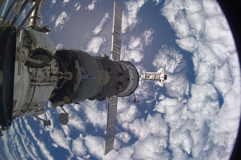 6. With Beautiful Blue-and-White Earth Below, Space Shuttle Atlantis (STS-129) Approaches the International Space Station, November 18, 2009, As Seen From the International Space Station (Expedition Twenty-One). Photo Credit: NASA; STS-129 Shuttle Mission Imagery (http://spaceflight.nasa.gov/gallery/images/shuttle/sts-129/ndxpage1.html), ISS021-E-029808 (http://spaceflight.nasa.gov/gallery/images/shuttle/sts-129/html/iss021e029808.html), NASA Human Space Flight (http://spaceflight.nasa.gov), National Aeronautics and Space Administration (NASA, http://www.nasa.gov), Government of the United States of America.