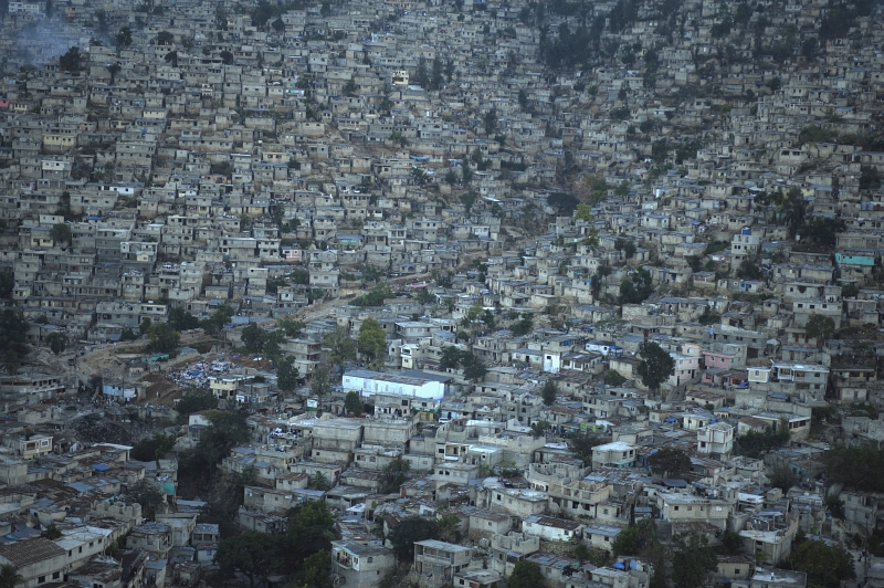 29. Aerial View of Port-au-Prince, January 15, 2010, Republique d'Haiti (Repiblik d' Ayiti) - Republic of Haiti. Photo Credit: Technical Sgt. (TSgt) James L. Harper Jr., United States Air Force; Defense Visual Information (DVI, http://www.DefenseImagery.mil, 100115-F-4177H-204) and United States Air Force (USAF, http://www.af.mil), United States Department of Defense (DoD, http://www.DefenseLink.mil or http://www.dod.gov), Government of the United States of America (USA).