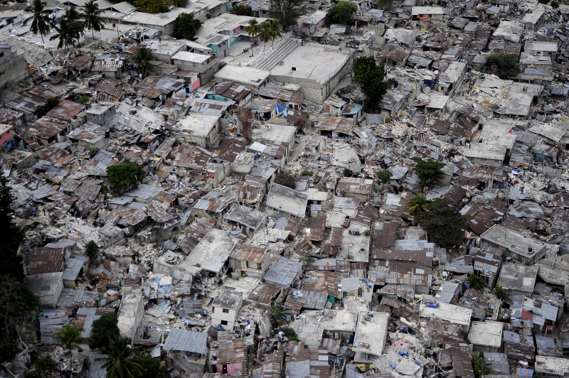 37. Damaged and Destroyed Homes, January 19, 2010, Republique d'Haiti (Repiblik d' Ayiti) - Republic of Haiti. Photo Credit: Technical Sgt. (TSgt) Dennis J. Henry Jr., United States Air Force; Defense Visual Information (DVI, http://www.DefenseImagery.mil, 100119-F-3715H-243) and United States Air Force (USAF, http://www.af.mil), United States Department of Defense (DoD, http://www.DefenseLink.mil or http://www.dod.gov), Government of the United States of America (USA).