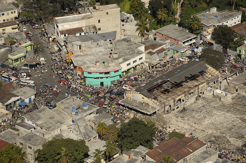 47. Street Busy With Trucks, Vans, Cars, Vendors, and Earthquake Survivors, January 23, 2010, Republique d'Haiti (Repiblik d' Ayiti) - Republic of Haiti.  Photo Credit: Master Sgt. Russell E. Cooley IV, United States Air Force; Defense Visual Information (DVI, http://www.DefenseImagery.mil, 100123-F-9712C-0076) and United States Air Force (USAF, http://www.af.mil), United States Department of Defense (DoD, http://www.DefenseLink.mil or http://www.dod.gov), Government of the United States of America (USA).