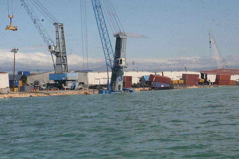 6. Another View of the Earthquake-Damaged Port Facility and Tumbling Shipping Containers, January 13, 2010, Port-au-Prince, Republique d'Haiti (Repiblik d' Ayiti) - Republic of Haiti. Photo Credit: CGC Forward; United States Coast Guard (USCG, http://www.uscg.mil) Visual Information Gallery (http://cgvi.uscg.mil/media/main.php, 100113-G-0000X-012), United States Department of Homeland Security (DHS, http://www.dhs.gov), Government of the United States of America (USA).