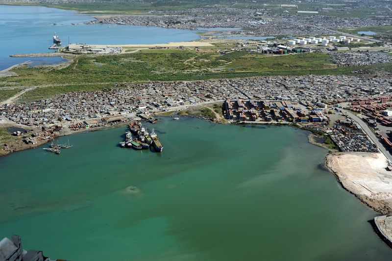 4. January 13, 2010: Another aerial photo of the port and surrounding area in Republique d'Haiti (Repiblik d' Ayiti) - Republic of Haiti. Photo Credit: Petty Officer 2nd Class Sondra-Kay Kneen, United States Coast Guard (USCG, http://www.uscg.mil) Visual Information Gallery (http://cgvi.uscg.mil/media/main.php, 100113-G-7070K-005), United States Department of Homeland Security (DHS, http://www.dhs.gov), Government of the United States of America (USA).