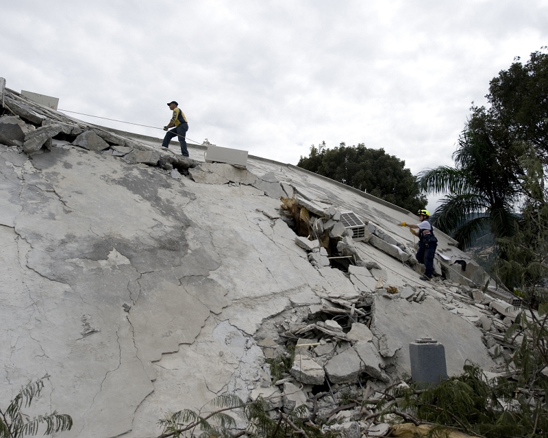 11. The Search For Survivors: Two Members of Virginia Task Force 1 (VATF-1), Fairfax County's Urban Search and Rescue Team, Scale A Collapsed Section of the Hotel Montana, January 14, 2010, Port-au-Prince, Republique d'Haiti (Repiblik d' Ayiti) - Republic of Haiti. Photo Credit: Mass Communication Specialist 1st Class Joshua Lee Kelsey, Navy News Service - Eye on the Fleet (http://www.news.navy.mil/view_photos.asp, 100114-N-6266K-005), United States Navy (USN, http://www.navy.mil), United States Department of Defense (DoD, http://www.DefenseLink.mil or http://www.dod.gov), Government of the United States of America (USA).