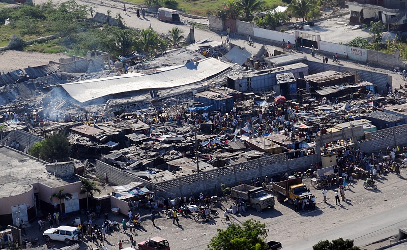 18. Earthquake Survivors Gather In A Severely Damaged Compound, January 15, 2010, Port-au-Prince, Republique d'Haiti (Repiblik d' Ayiti) - Republic of Haiti. Photo Credit: Mass Communication Specialist 2nd Class Candice Villarreal, Navy News Service - Eye on the Fleet (http://www.news.navy.mil/view_photos.asp, 100115-N-6247V-495), United States Navy (USN, http://www.navy.mil), United States Department of Defense (DoD, http://www.DefenseLink.mil or http://www.dod.gov), Government of the United States of America (USA).