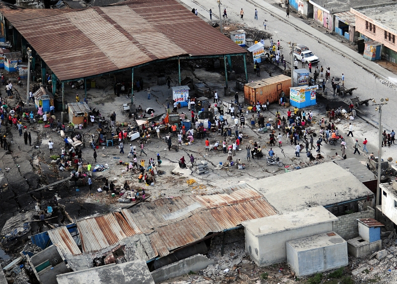 21. Earthquake Survivors gather In A Dilapidated Marketplace, January 16, 2010, Port-au-Prince, Republique d'Hati (Repiblik d' Ayiti) - Republic of Haiti. Photo Credit: Mass Communication Specialist 2nd Class Candice Villarreal, Navy News Service - Eye on the Fleet (http://www.news.navy.mil/view_photos.asp, 100116-N-6247V-147), United States Navy (USN, http://www.navy.mil), United States Department of Defense (DoD, http://www.DefenseLink.mil or http://www.dod.gov), Government of the United States of America (USA).