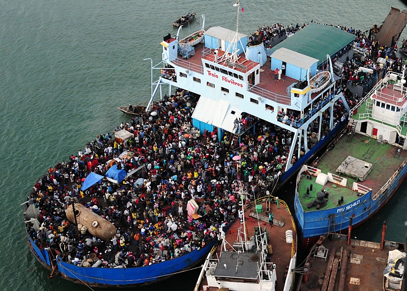 22. At A Port In Haiti, Earthquake Survivors Pack and Crowd A Ferry -- the Trois Rivieres, January 16, 2010, Republique d'Hati (Repiblik d' Ayiti) - Republic of Haiti. Photo Credit: Mass Communication Specialist 2nd Class Candice Villarreal, Navy News Service - Eye on the Fleet (http://www.news.navy.mil/view_photos.asp, 100116-N-6247V-143), United States Navy (USN, http://www.navy.mil), United States Department of Defense (DoD, http://www.DefenseLink.mil or http://www.dod.gov), Government of the United States of America (USA).