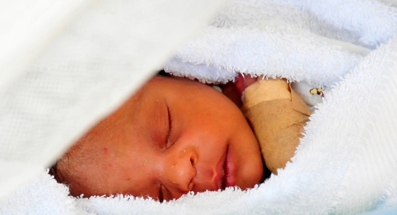 39. Tiny Elisabeth Joassaint (or Elizabeth Joassaint) -- A Less-Than-One-Month-Old Infant, Rests In A Tent Hospital After Spending Eight Days Trapped In Her Home Before Being Rescued, January 20, 2010, Jacmel, Republique d'Haiti (Repiblik d' Ayiti) - Republic of Haiti. Photo Credit: Mass Communication Specialist 2nd Class Daniel Barker, Navy News Service - Eye on the Fleet (http://www.news.navy.mil/view_photos.asp, 100120-N-4774B-802), United States Navy (USN, http://www.navy.mil), United States Department of Defense (DoD, http://www.DefenseLink.mil or http://www.dod.gov), Government of the United States of America (USA).