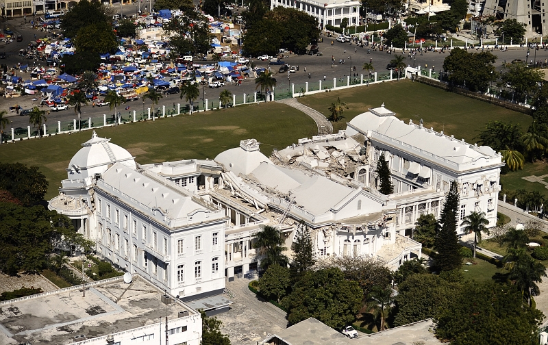 57. Rear View of the Earthquake-Damaged Presidential Palace (National Palace), January 28, 2010, Port-au-Prince, Republique d'Haiti (Repiblik d' Ayiti) - Republic of Haiti. Photo Credit: Mass Communication Specialist 2nd Class Kristopher Wilson, United States Navy; Defense Visual Information (DVI, http://www.DefenseImagery.mil, 100128-N-5345W-277) and United States Navy (USN, http://www.navy.mil), United States Department of Defense (DoD, http://www.DefenseLink.mil or http://www.dod.gov), Government of the United States of America (USA).